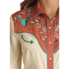 Style number: LWN2S02387. Cream shirt. Red western yokes & trim. Floral embroidery on yokes. Contrast turquoise piping. Snap front closure. Adjustable snap cuffs. Collared neckline. 100% cotton. Western Retro Outfits, Western Style Embroidery, Country Western Dresses, Western Tops For Women, Country Apparel, Detail Embroidery, Embroidery Shirts, Queen Outfits, Retro Embroidery