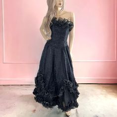 Indulge In The Elegance And Sophistication Of Our 80s Vintage Ruffled Tulle & Lace Black Evening Gown. This Exquisite Dress Features A Delicate Black Floral Lace Overlay On A Full Chiffon Layer Both Trimmed In Ruffled Chiffon, With Two Additional Layers Of Lined Black Poly And White Tulle. The Sleeveless Design And Boned Bodice Are Beautifully Adorned With Matching Ruffled Chiffon, While The Rear Zipper Closure With Tulle Ruffle Bustle Make For A Truly Luxurious And Timeless Bridal Ensemble. "A Lace Black Wedding Dress, Vintage Dresses 80s, A Black Wedding, Black Wedding Gowns, Black Lace Gown, Vintage Ball Gowns, Black Wedding Dress, Black Evening Gown, Black Prom Dress