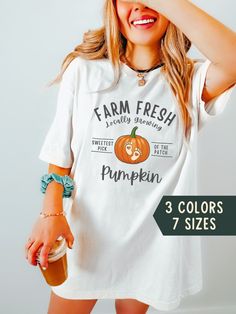 "This Fall Pregnancy Announcement T-Shirt is the ideal clothing choice for announcing your baby's impending arrival in style. Featuring an adorable pumpkin graphic design that pays homage to the fall season, along with the words \"Farm Fresh locally growing pumpkin, sweetest pick of the patch,\" this comfy tee ensures you're both cozy and festive. Share your excitement with your loved ones and relish in the warmth of the season as you eagerly anticipate the arrival of your little pumpkin. ⭐ ABOUT OUR SHIRTS  ⇒ Unisex Jersey Short Sleeve Tee ⇒ Cotton ⇒ Super soft and high quality print! ⇒ Light fabric ⇒ Tear away label ⇒ Runs true to size YES! I take custom requests. Simply send me a message! 🎉 HOW TO ORDER 1. Select your tshirt size, color and quantity 2. Click \"Add to Cart\" 3. Type any Baby Announcement Fall, Growing Pumpkin, Halloween Maternity Shirt, Halloween Maternity, Fall Baby Announcement, Halloween Pregnancy Shirt, Fall Pregnancy, Fall Pregnancy Announcement, Pumpkin Graphic