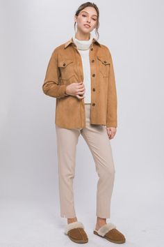 Cozy up while staying in style with the Favorite Time of Year Camel Shacket! This ultra-soft, shirt-meets-jacket is composed of classic suede fabric that shapes a collared neckline and long sleeves with button cuffs. The slightly oversized bodice has a functional button placket down the center, front patch pockets, and ends at a rounded hem. Wear as a shirt, tie it in the front, or as a jacket. The possibilities are endless! Shacket Color: Camel Fit: True to size; Relaxed Collared neckline Ultra Shirt Tie, Suede Fabric, The Favorite, Staying In, Button Placket, Medium Weight, Patch Pocket, Camel, Bodice