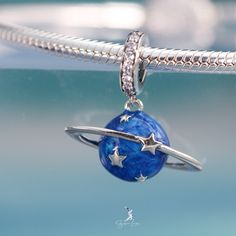 This is charm only, bracelet is sold separately. This beautiful enamel blue planet pendant charm is made of solid 925 sterling silver and enamel color, features 3D blue planet with moon and star. This planet dangle charm will fit original bracelet or wear as a pendant for necklace. Experience the wonder of the universe with our stunning Blue Planet pendant charm! Crafted from solid 925 sterling silver and vibrant enamel, this charm showcases a 3D blue planet adorned with a glowing moon and star. Sterling Silver Space-themed Jewelry, Silver Star Charm Celestial Charms, Silver Star Charm Celestial, Blue Star Charm Round Pendant Jewelry, Silver Celestial Star Charm, Silver Star Charm With Celestial Style, Blue Round Pendant Jewelry With Star Charm, Celestial Sterling Silver Charms Jewelry, Celestial Silver Jewelry With Charms