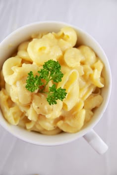 a white bowl filled with macaroni and cheese