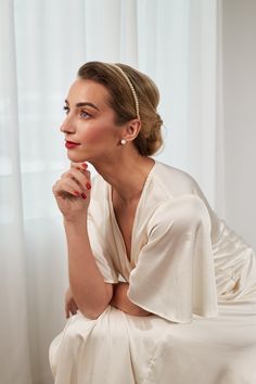 Elevate your bridal allure with our handmade ivory pearl hairpiece, a masterful fusion of modernity and minimalism. Lightweight and meticulously crafted, this headpiece is perfect for brides seeking a minimalist wedding look with a low bun hairstyle. The larger size pearl beads, sewn-on with precision, radiate elegance and grace, making this accessory a true embodiment of understated beauty. Our commitment to craftsmanship ensures that each pearl is securely sewn, offering unmatched durability and distinction. The handcrafted touch sets this headpiece apart from mass-produced alternatives, adding a special charm to your wedding ensemble. For brides who appreciate the finesse of minimalism, this headpiece is the quintessential choice. Let its lightweight comfort and timeless design compleme Pearl Hairpiece, Low Bun Hairstyle, Pearl Bridal Headband, Low Bun Hairstyles, Bride Headband, Star Headband, Bride Headpiece, Bun Hairstyle, Wedding Look