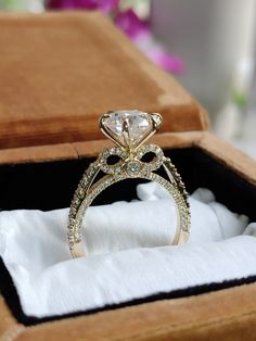 an engagement ring is sitting in a box