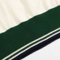 - Knitted Polo- 100% cotton yarn- Unlined- Regular fit- Machine washable Fabric & Care- Delicate Machine Wash at 30 degrees(86℉) with similar colors.- Iron inside out on low temperature.- Store flat.- Do not tumble dry.- Do not bleach. Green V-neck Top With Ribbed Cuffs, White Ribbed Polo Collar Top, White Ribbed Top With Polo Collar, White Knit Polo Sweater With Ribbed Collar, Casual Green Polo Sweater With Ribbed Cuffs, Green Knit Sweater With Ribbed Collar, Green Casual Polo Sweater With Ribbed Collar, White Polo Collar Sweater For Winter, Casual Green Polo Sweater With Ribbed Collar