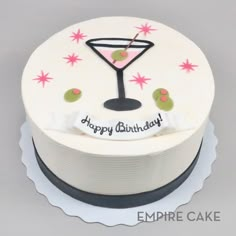 a birthday cake with a martini glass on top