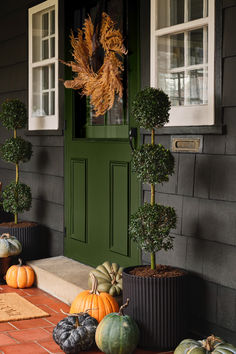 Create a classic fall porch with simple updates that are sure to impress. Start with a dried wreath for timeless charm, and complement it with black pots filled with evergreen plants. Add pumpkins in various shades and sizes for a playful seasonal touch. Complete the look with a jute welcome mat that greets guests at the door.

Shop for your home at Birch Lane.