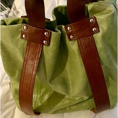 This Bag Is Brand New. I Have Only Worn It One Time. It Is A Very Special Soft Italian Leather “Butter Leather”, The Colour Is Chartreuse And It Is Sleek, Comfortable And A Beautiful Piece. The Tote Is 16 Inches Across And 14 Inches Long, The Two Handles Measure 11 Inches From The Opening Of The Tote To The Top So It Feels Very Comfortable While Carrying, Large Enough To Carry A Laptop And Phone Among Other Things, It's Not A Tote To Fully Stuff, It's More Sleek Slim And Elegant And Looks Very C Green Coated Canvas Bag With Leather Handles, Green Bags With Leather Handles And Coated Canvas, Green Coated Canvas Shoulder Bag For Daily Use, Everyday Green Leather Shoulder Bag, Green Leather Shoulder Bag With Leather Handles, Green Coated Canvas Tote Shoulder Bag, Green Leather-lined Shoulder Bag For Shopping, Green Shoulder Bag With Leather Lining For Shopping, Green Leather Everyday Bags