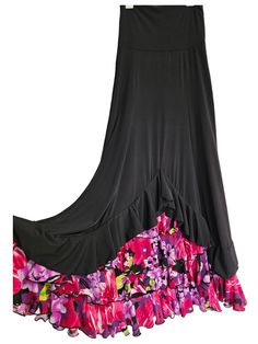 This listing is for a Beautiful flamenco skirt , made all with a very  soft and comfortable  stretch fabric in  black  with floral print polyester,A line ,very flattering , choose your size, ideal for your classes or recitals   ,fold over waistband will make it adaptable to your height (no zipper) also this stretch fabric  makes the skirt  adaptable to different sizes and body shapes . Measurements are approximately , SMALL/MEDIUM Waist stretches from 26'' (66cm) to 32'' (81.5cm) Hips stretches from 37'' (94cm) to 42'' (107cm) Total length is 47" (119.5cm) including the foldable waistband of 6.5" (17cm) MEDIUM/LARGE Waist stretches from 28'' (71cm) to 36'' (91.5cm) Hips stretches from 39'' (99cm) to 46'' (117cm) Total length is 48" (122cm) including the foldable waistband of 6.5" (17cm) LA Black Tiered Ruffled Maxi Skirt, Fitted Black Tiered Maxi Skirt, Spring Black Maxi Skirt With Ruffle Hem, Black Stretch Skirt With Ruffle Hem, Black Floral Print Tiered Skirt, Black Floral Print Tiered Maxi Skirt, Long Black Skirt With Attached Cancan, Black Floral Print Flowy Skirt, Black Flowy Floral Skirt