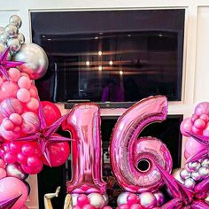 balloons are arranged in the shape of the number twenty six, and the word'16 '