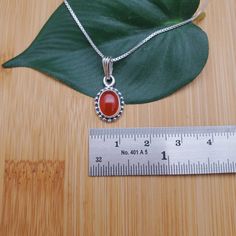 "Visit our on-line shop at: Etsy.com/shop/AlbuquerqueDesigns *sterling silver necklace pendant *Small pendant with silver box chain necklace 18\" *southwestern jewelry *carnelian / healing carnelian *calibrated pre-cut stones: 9x7mm oval shape *back of jewelry items are all covered / do not show the back of stones *all jewelry items are made to ship, slight variations in stones will occur comparing to pictures. *size of a penny is 19mm or a dime is 18mm in diameter for comparing size with jewelr Classic Orange Necklace For Gifts, Classic Orange Necklace For Gift, Carnelian Oval Pendant Necklace As A Gift, Carnelian Oval Pendant Necklace For Gift, Stamped 925 Carnelian Jewelry, Orange Oval Sterling Silver Necklace, Oval Orange Sterling Silver Necklace, Silver Necklace Pendant, Red Carnelian