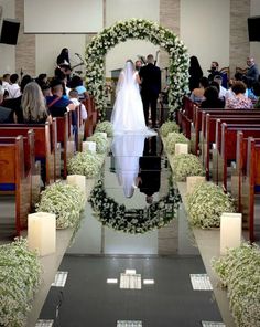 the bride and groom are walking down the aisle