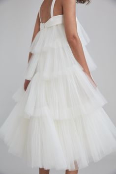 Over three decades ago, Ethiopian-born Amsale Aberra began crafting modern, personalized wedding dresses, beginning with her own. Today, her distinct bridal gowns—handmade with couture techniques in AMSALE’s New York City atelier—share their tasteful femininity, unstated glamour and attention to detail with sophisticated women the world over. Crafted in cascading layers of a divinely delicate fabric, the Tiered Mushroom Pleated Tulle Trapeze Dress boasts muted straps and mesmerizing movement. Pr Amsale Dress, Couture Techniques, Pleated Tulle, Sophisticated Women, French Dress, Wedding 2025, Trapeze Dress, Dress Inspo, Little White Dresses