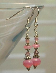 Czech glass, Milk glass, Swarovski crystal and Bali sterling silver beads are featured in these long dangle earrings. All metal is 925 sterling silver. Each earring weighs 1.6 grams compared to a US dime weighing in at 2.268 grams. Size and length can be determined in the photo above as compared to a ruler and a US dime. If you are interested in these earrings and would like more photos or have any questions please feel free to contact me. I usually answer all inquiries the same day within the h Sterling Silver Beaded Crystal Earrings, Beaded Sterling Silver Crystal Earrings, Czech Glass Crystal Dangle Earrings, Pink Sterling Silver Dangling Earrings, Sterling Silver Pink Dangling Bead Earrings, Silver Beaded Earrings With Czech Glass, Silver Dangle Earrings With Czech Glass, Dangle Beaded Earrings With Czech Glass, Dangle Czech Glass Beaded Earrings