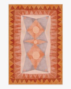 an orange and grey rug with geometric shapes on it's sides, including two circles