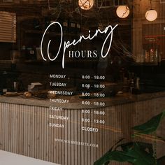 an open hours sign in the window of a restaurant