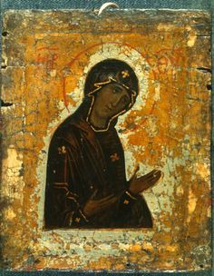 an icon of the virgin mary in gold and black