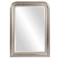 a silver framed mirror on a white wall