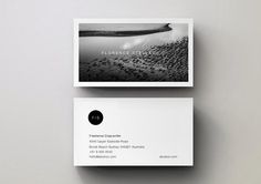 two business cards with black and white images on them