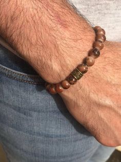 Men's Beaded Bracelet  Bead color is Brown with 1 charm as shown in pictures. Boys Bracelet, Men Beaded Bracelet, Boys Bracelets, Bracelet Bead, Bracelet Men, Mens Beaded Bracelets, Braided Bracelets, Arm Band, Bracelets For Men