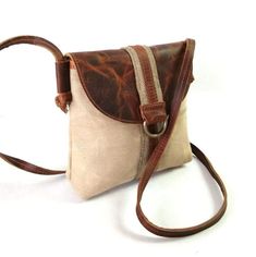 ➤ Specification * Color: Brown And Beige * Material: Cowhide And Canvas * Size: 7 x 2 x 6.5 ➤ Features * High-Quality Leather With Hiqh Quality Inner Stitched Fabric for Durability. * This messenger bag acts as the perfect accessory to complete your look and make you stand out at an affordable price. * The elegant design is long-lasting, lightweight and a fine quality full-grain leather product. * It shows your personality and style every time you use it. * Use this bag as small personal items. Brown Canvas Satchel With Mobile Phone Bag, Daily Use Crossbody Flap Bag With Leather Trim, Everyday Leather Trim Flap Shoulder Bag, Beige Saddle Bag For Everyday Use, Everyday Pouch Shoulder Bag With Leather Trim, Beige Saddle Bag With Leather Handles For Everyday Use, Leather Trim Pouch Bag For Daily Use, Leather Trim Daily Use Pouch Bag, Daily Use Leather Trim Pouch Bag