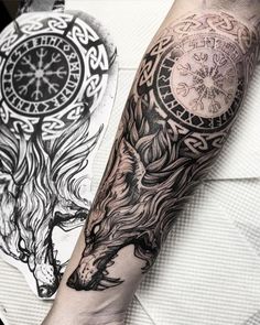 a man's arm with a clock on it and a wolf in the middle