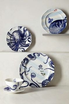 blue and white plates with an octopus design on them, sitting next to each other