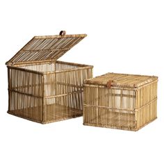 two wicker boxes with lids on each side