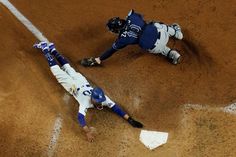 a baseball player sliding into home plate