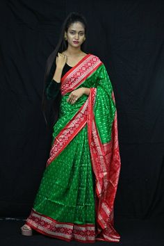 Exclusive hand-woven Sambalpuri silk saree with tribals. Finest pure handwoven sambalpuri ikat silk saree with traditional motifs woven by the master weavers of Sambalpur, Odisha. It has lovely patterns and is world-famous for its stunning colours, texture and designs. Occasion: Party Wear Fabric: Sambalpuri Primary Color: Green Secondary Color: Red Material: Mulberry Silk/ Sambalpuri Silk Pattern: Motif Border Type: Ikat Border Size: Medium Blouse Piece: Included Care: Dry Clean Disclaimer : This is a genuine handwoven piece, unevenness in the selvedge and weave could be expected and colours may fade or bleed due to the traditional dyeing method employed. Traditional Green Ikat Print Saree, Green Ikat Print Saree In Traditional Drape, Green Ikat Print Traditional Saree, Green Traditional Wear With Ikat Print Drape, Green Traditional Wear With Ikat Print And Traditional Drape, Green Ikat Print Traditional Drape Wear, Green Traditional Wear With Ikat Print, Green Ikat Print Saree, Green Ikat Print Dupatta Traditional Drape