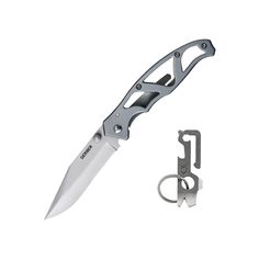 a knife with a keychain attached to it and an open blade on the side