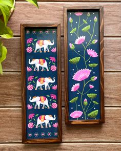 two wooden boxes with painted elephants and flowers