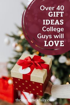 a person holding a present box with the words over 40 gift ideas college guys will love