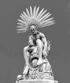 a statue is shown with an elaborate headdress on it's face and arms