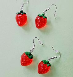 Some cute strawberries to buy for her. Fun Red Resin Earrings, Fun Style Red Resin Earrings, Red Resin Novelty Earrings, Novelty Red Resin Jewelry, Red Plastic Earrings For Gift, Red Resin Novelty Jewelry, Fun Red Resin Jewelry, Cute Red Earrings With Fruit Design, Red Novelty Plastic Jewelry