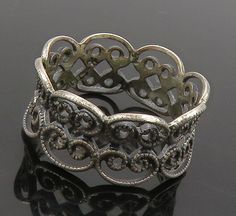 925 Sterling Silver - Vintage Dark Tone Pretzel Knot Band Ring Sz 5 - RG16151  925 Sterling Silver - Vintage Dark Tone Pretzel Knot Band Ring Sz 5 - RG16151  Jewelry Type:         Ring  Metal Type:            925 Silver  Metal Size:             5 Finger  Stone Type:            N/A  Condition:              N/A  Jewelry Weight:     2 Grams  PLEASE NOTE: THIS ITEM IS PRE-OWNED. ALTHOUGH MOST ITEMS ARE IN VERY GOOD CONDITION, SOME MAY NEED CLEANING AND/OR MINOR REPAIRS. WE MAKE A VERY STRONG EFFORT TO UPLOAD CLEAR PICTURES. PLEASE INSPECT ALL PICTURES AND ASK ALL QUESTIONS YOU MAY HAVE PRIOR TO MAKING A PURCHASE. NOT ALL STONES ARE GENUINE, SOME ARE ENHANCED OR CREATED. Silver Metal Band Jewelry, Silver Band Jewelry In Metal, Vintage Round Filigree Ring With Oxidized Finish, Victorian Silver Jewelry With Decorative Band, Vintage Silver Open Band Jewelry, Vintage Sterling Silver Open Band Jewelry, Elegant Oxidized Filigree Ring For Anniversary, Victorian Style Silver Metal Rings, Victorian Silver Metal Rings