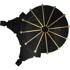 a black umbrella with gold dots on it