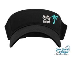 Save 20% off your first purchase by signing up at https://signup.sewvividdesigns.comThis lightweight and comfortable visor features Salty Soul with a palm tree embroidered on your choice of visor. For more font options, send me a message and we will find the perfect font for you!Visor featured in photo: BlackPalm Tree Color in photo: Aqua🧢 Visor Details 🧢-One size fits most-Pre-curved visor-100% cotton-Hook and loop adjustable closure (Velcro)-Visor panel height 2.25"-Visor Bill length 2.75" Gigi Gifts, Salty Soul, Custom Embroidered Hats, Real Estate Agent Gift, Vacation Hat, Gigi Gift, Real Estate Gifts, Golf Visor, Distressed Baseball Cap