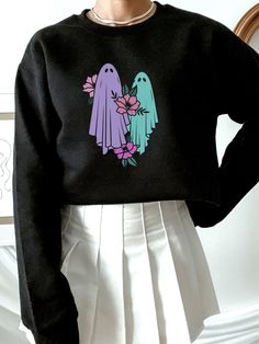 Halloween is coming which means cool weather and Halloween Crewneck Sweatshirts! Our pastel goth ghost sweatshirt is sturdy and warm, bound to keep you warm during the Halloween season. Perfect for pastel goth closets. The pastel goth ghost Sweatshirt design is perfect for spooky season or every day! Be sure to pick up this pastel goth ghost Halloween crew neck sweatshirt for your Halloween outfit ideas! Goth Closet, Ghost T Shirt, Halloween Outfit Ideas, Halloween Crewneck Sweatshirt, Halloween Is Coming, Ghost Sweatshirt, Halloween Crewneck, Goth Clothing, Halloween Outfit