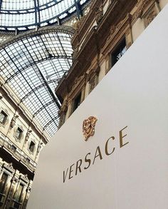 the versa sign is in front of an ornate glass ceiling