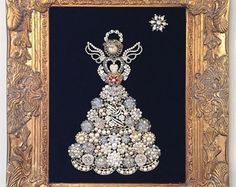 an ornate gold frame holds a beaded christmas tree