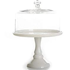 a cake stand with a glass cover on top