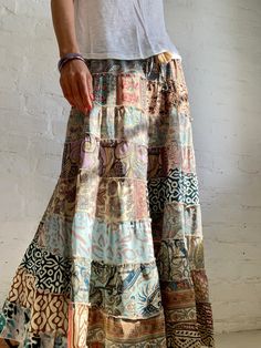 "Beautiful long boho style tiered skirt for summer time parties and daily wear  Super comfy, loose flared hem  Made patchwork of varieties fabric  MEAESURE free size Elastic waist 26-36} length 39\" MATERIAL *polyester Please visit also  https://www.etsy.com/shop/AltheaStores CARE INSTRUCTIONS  * Wash in warm water * Hand wash recommended * Hang to dry  IMPORTANT NOTE  * Please note that colour shown on your monitor may vary from the colour of the fabric, due to light. If you have any doubts ple Bohemian Tiered Skirt For Summer, Boho Print Tiered Skirt For Festival, Spring Bohemian Maxi Skirt With Ruffles, Bohemian Ruffled Maxi Skirt For Spring, Bohemian Ruffled Skirt For Summer, Hippie Tiered Skirt With Boho Print, Bohemian Ruffled Maxi Bottoms, Bohemian Ruffled Maxi Skirt For Vacation, Bohemian Maxi Bottoms With Ruffles