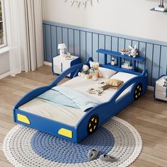 a child's bed with blue and yellow trimmings in a children's room