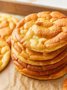 a stack of cookies sitting next to each other on top of a table with orange slices