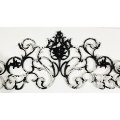 an ornate black and white wall decoration