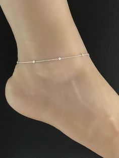 925 Sterling Silver Rhodium Plated Beaded Ankle BraceletANKLET FEATURES:Metal:  All components are made from solid .925 Sterling Silver Rhodium Plated Model is wearing 9" in length  solid .925 Sterling Silver Bead ChainChain Length:  9 inchYour Dainty Rolo Beaded Anklet will arrive in a gift box, beautifully wrapped and ready for giftingPlease send me a message if you have any questions before or after placing your order. Please also view my policy before purchasing. **************************** Delicate Silver Anklets For Summer, Silver Beaded Toe Ring Anklets, Elegant Sterling Silver Anklets For Summer, Silver Beaded Anklets For Wedding, Silver Wedding Anklets With Silver Beads, Wedding Silver Beaded Anklets, Silver Minimalist Anklets For Party, Dainty Sterling Silver Anklets For Summer, Elegant Sterling Silver Bracelets For Summer