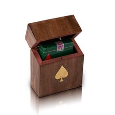 an open wooden box with playing cards inside