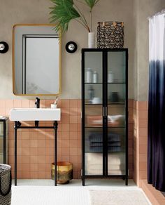 a bathroom with a sink, mirror and cabinet in it's centerpieces