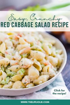 a white bowl filled with pasta salad on top of a table